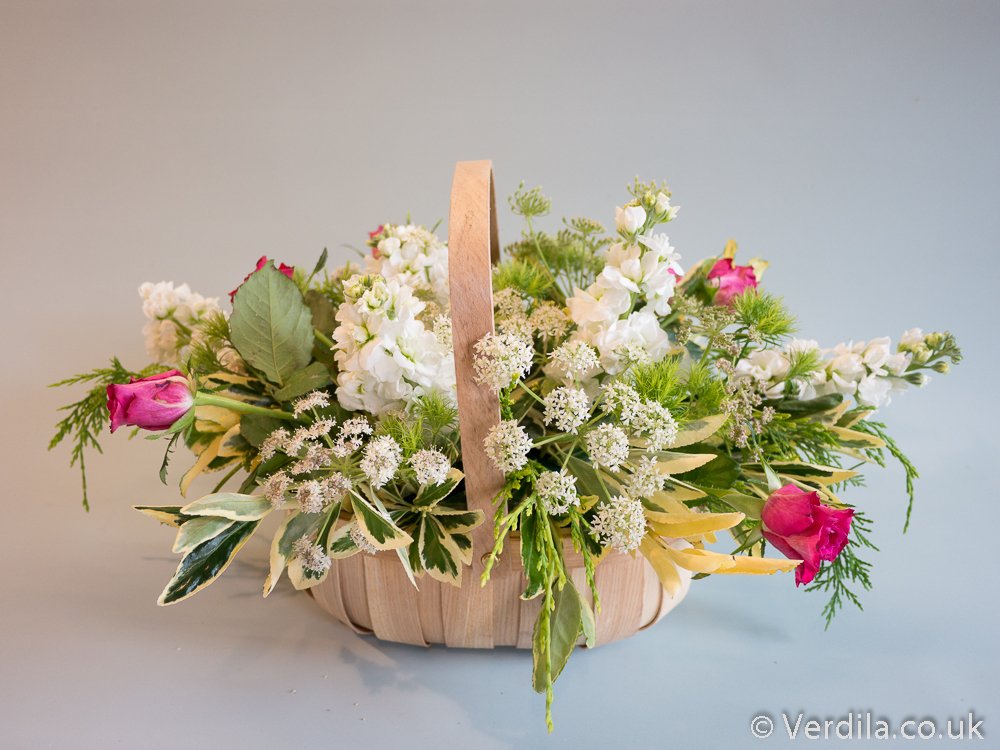 A country trug with supermarket flowers and just  a few bits of cow parsley and foliage from the garden. #countrybasketflowers #rusticflowers  #trugflowers