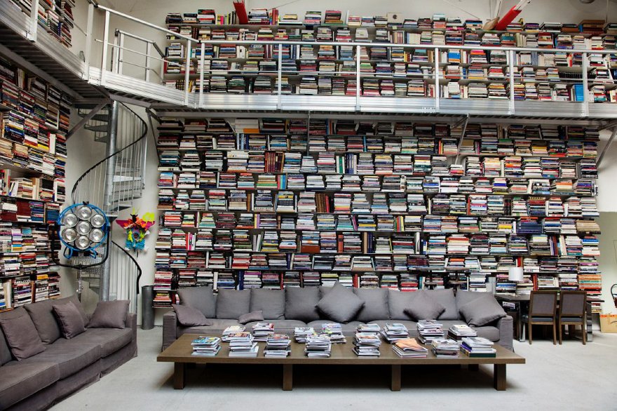 Fashion icon Karl Lagerfeld stores his books horizontally. His personal library reportedly houses over 230,000 books... mostly art books. Apparently when Karl reads a paperback, he rips out the pages as he goes. “I’m mad for books… It is a disease I won’t recover from,” he says.
