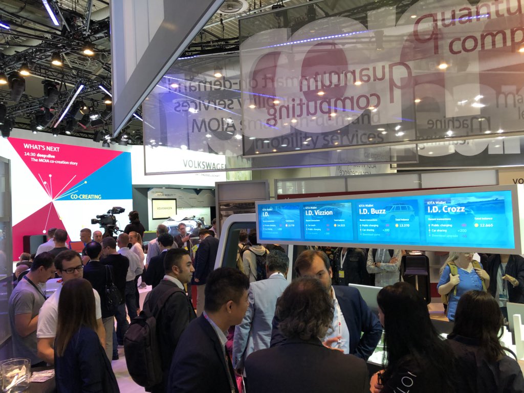 DomSchiener's tweet photo. Finally got to see the #Volkswagen booth with #IOTA as the enabler for the mobility use cases. Really proud how far we've come over the last few years and months. Very excited how much further we will go as a foundation, community and ecosystem. https://t.co/hOJ7RVSSVl