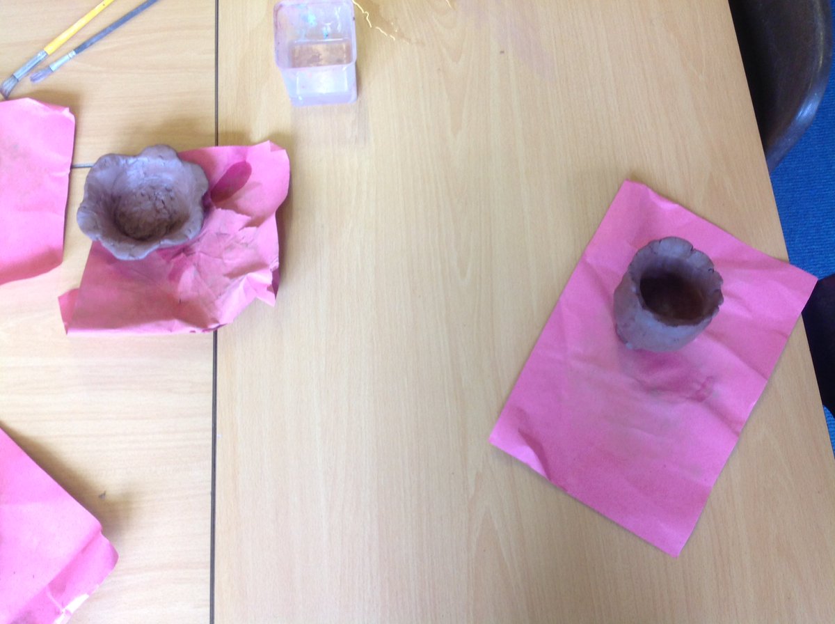This afternoon Year 2 made clay pots with our African friends.