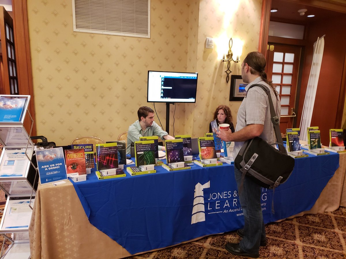JBLearning's tweet photo. Greetings from #CISSE2018 in New Orleans! Here are Ned Hinman and Laura Pagluica demoing the ISSA Virtual Security Cloud Labs for Fundamentals of Information Systems Security! #C18SE #22ndColloquium https://t.co/8serVGcXGB