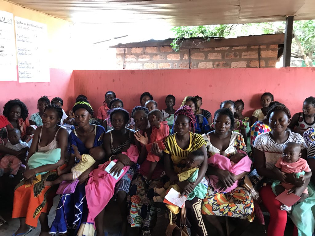 doctorsoumya's tweet photo. At a primary health center in Bangui, CAR, immunization clinic. A girl waits with her 9th sibling while mother is at work. Urgent need for reducing maternal and child mortality, huge govt commitment. @WHO ready to support @DrTedros @WHOAFRO https://t.co/tK9k1OSDwS
