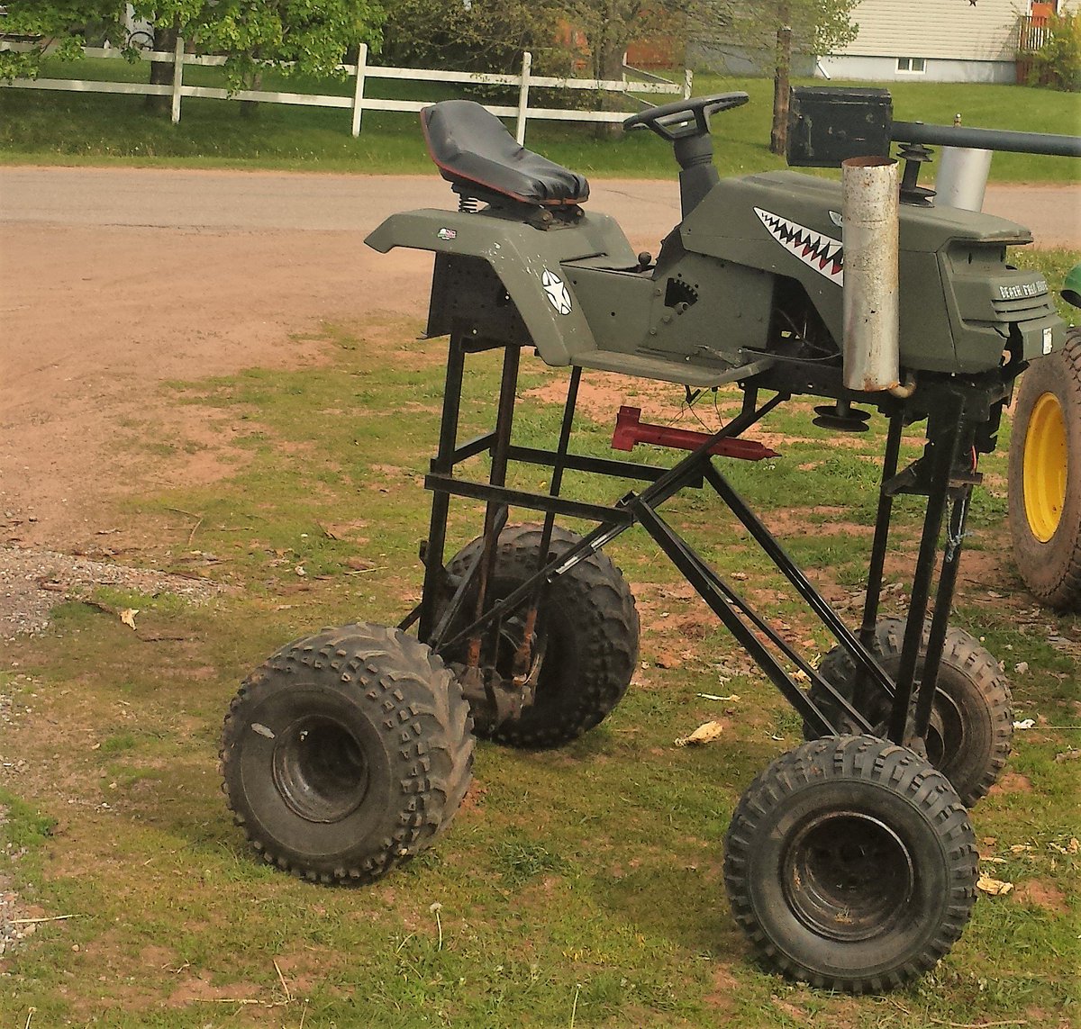 LotSixteen's tweet photo. OK #PEI. I don't know whether to be impressed, amused or scared, but lawn mowing in #Miscouche has taken on a decidedly Mad Max, apocalyptic vibe. https://t.co/x6UHqcaf1h