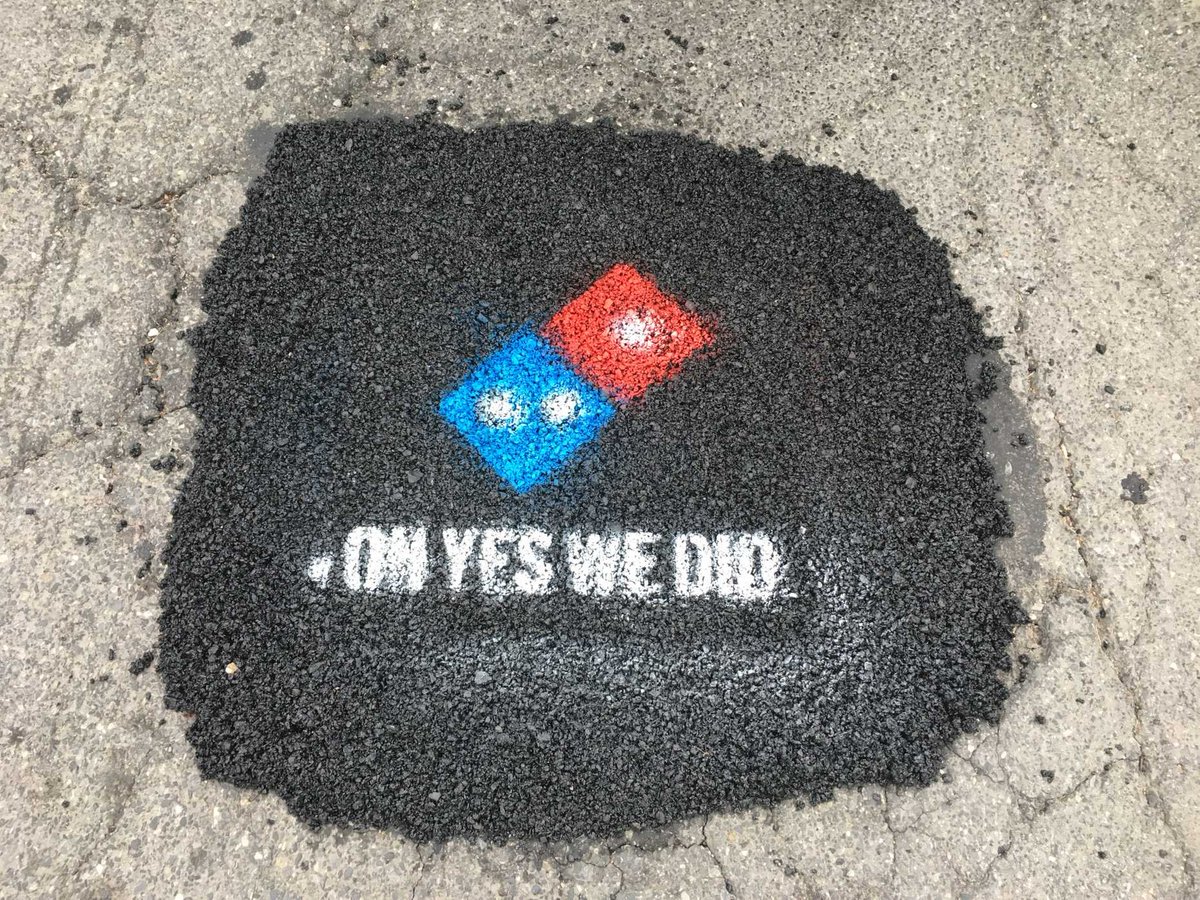 Mandogyrocks's tweet photo. Domino's been fixing Pot Holes. 
When did they get a permit to fix pot holes and is it even legal for them to put their logo on it? https://t.co/WZ3MibgWr3