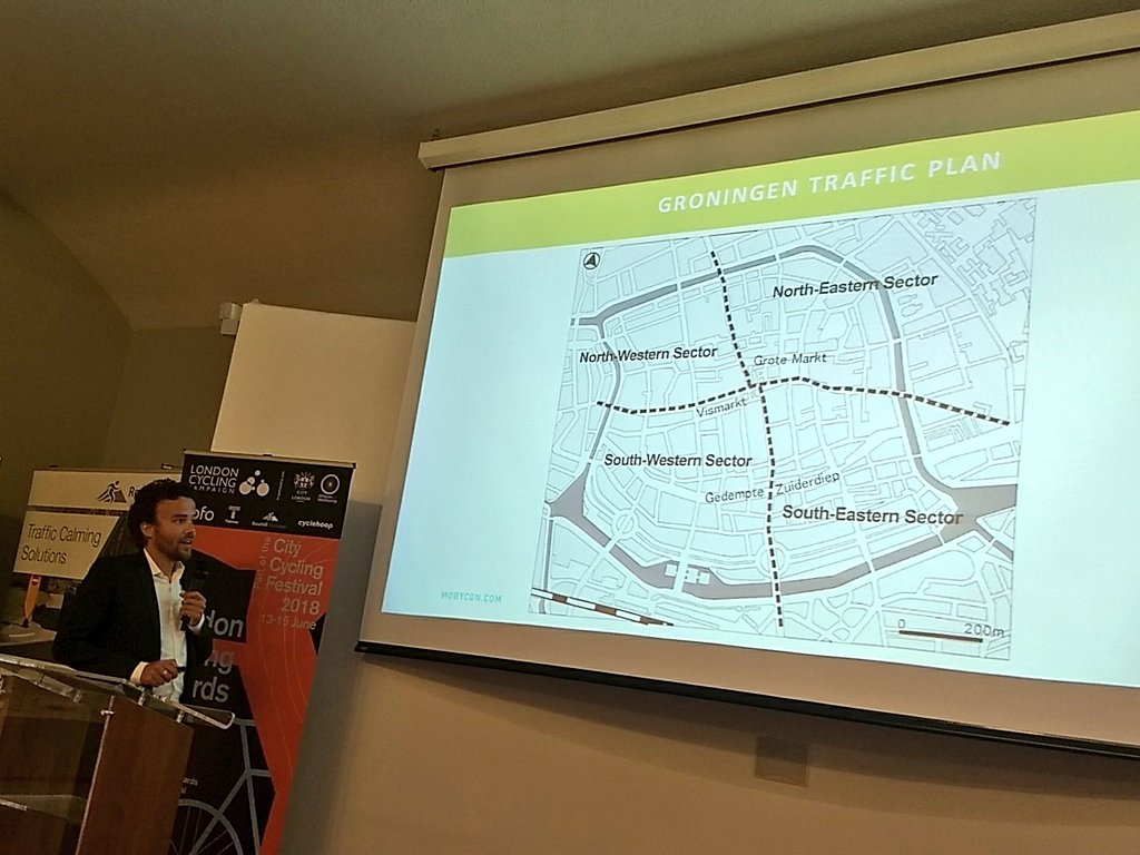 London_Cycling's tweet photo. @lennartnout of @mobycon talking about town centre planning now. 1km wide "low traffic neighbourhoods" work well as 20mph zones as after 6 minutes driving people tend to speed up. #LiveableLDN #CityCyclingFestival https://t.co/wskRghPVu2