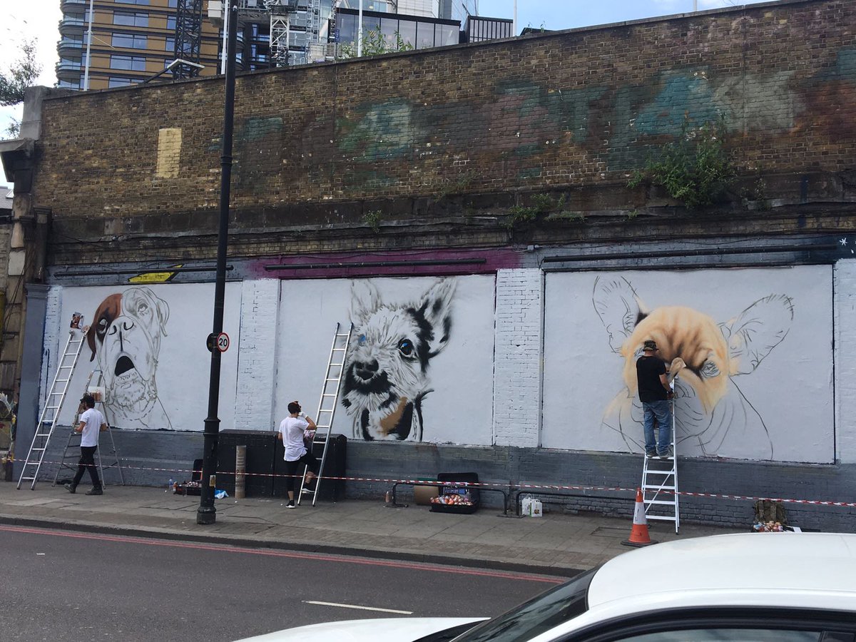 AllDogsMatter's tweet photo. Couldn't be MORE excited to see @globalstreetart x @AllDogsMatter charity mural go up today!  Featuring (left-right) ex-ADM Kingsley, Milly + Ernest! Make sure you go and see them on the famous #ShoreditchArtWall 🎨🐶#alldogsmatter #adoptadog #adoptdontshop #streetart #dogart https://t.co/ml4bKvU5sv
