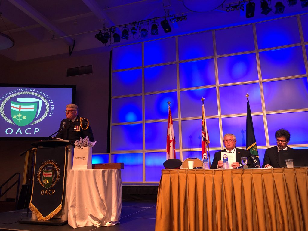SgtKoopman's tweet photo. At the start of the #OACP2018’s AGM @WRPSToday’s @Chief_BLarkin thanks the members for his term as the @OACPOfficial President. An inspiring & charismatic leader. The reins will soon be handed over. Outgoing Executive Director Ron Bain & @Coutorocks10 seated. #OACP18 https://t.co/m04ZKxMjc1