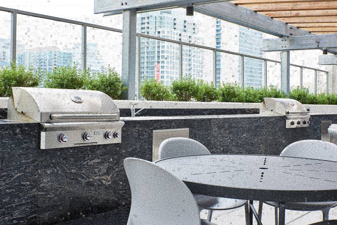 Rooftop lounge at Next Apartments in River North outfitted with numerous gas grills adorned in cobra black granite leather finish

Images by <a href="/DavidCutrano/">David Cutrano</a>