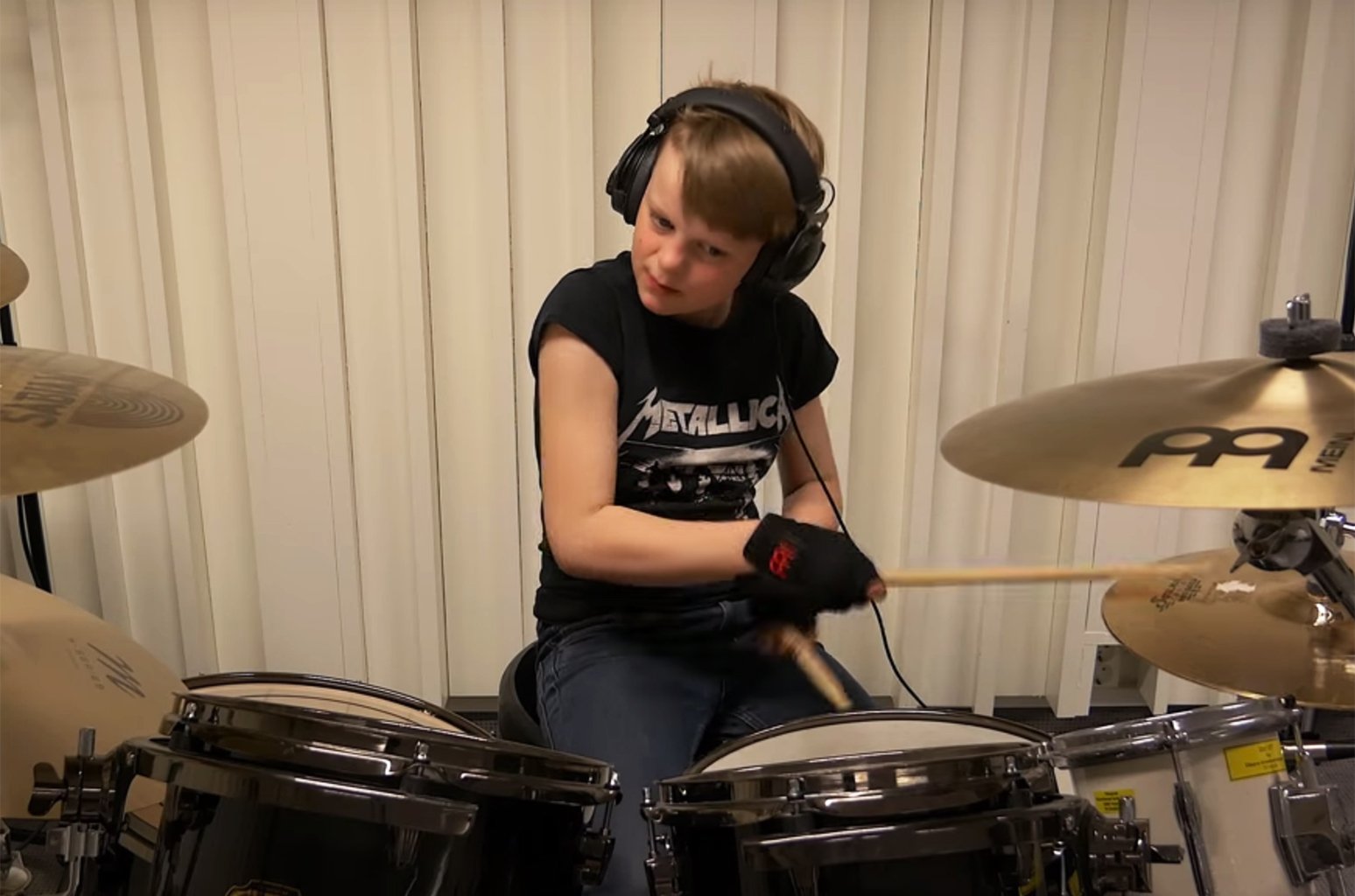 10-year-old drummer plays entire. 