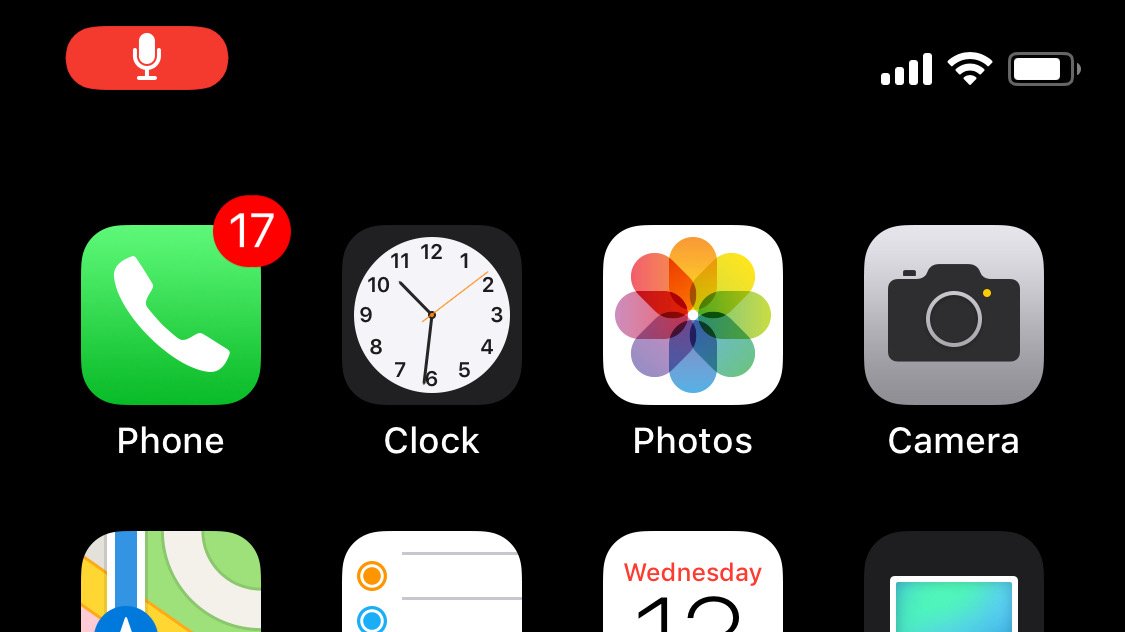 A screenshot of the iOS home screen with a red "recording" indicator in the upper left.