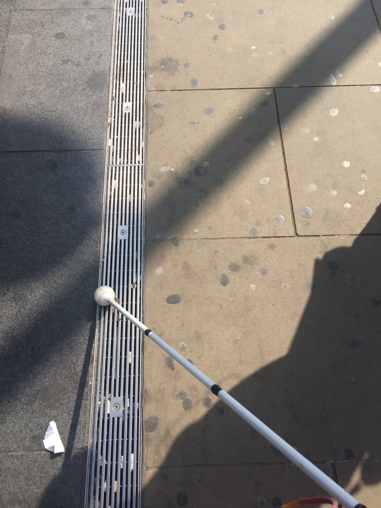 VI people use other tactile cues like drain covers, pavement texture changes & level changes to navigate. I use this drain grate that follows the south side of the kings cross plaza to get to the pedestrian crossing, stay in a straight line & avoid crowds.