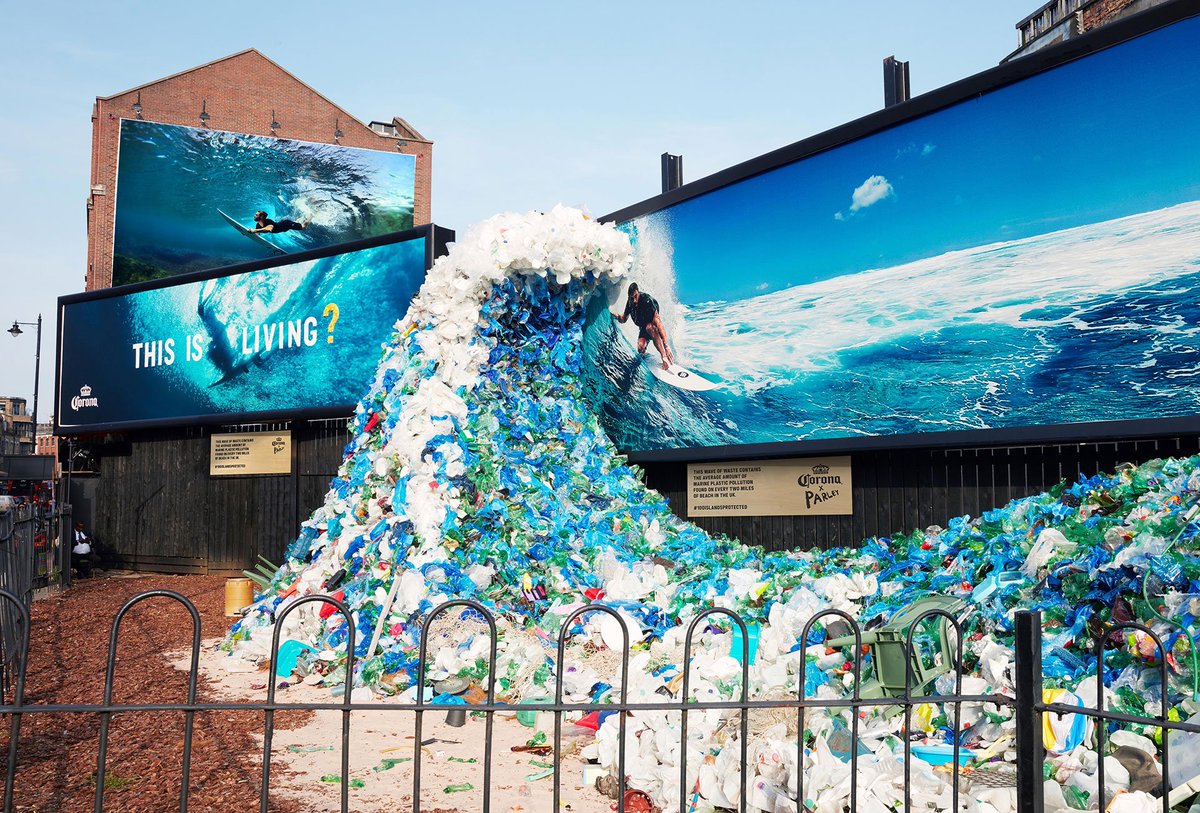 nudd's tweet image. Corona hijacked its own ads to raise awareness of plastic pollution in the oceans. "Wave of Waste," a sculpture in London, features Chris Hemsworth surfing a wave of plastic collected in the U.K. Agency: W+K Amsterdam. Artist: Andy Billett.