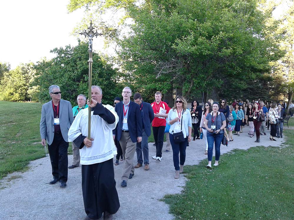 JOURNALISTS PRAY — Ed Langlois, Sentinel editor, took this photo of Catholic journalists in procession at the Shrine of Our Lady of Good Help in eastern Wisconsin. Mary appeared to an immigrant girl there in 1859. It’s the only approved Marian apparition in U.S. #cmctitletown