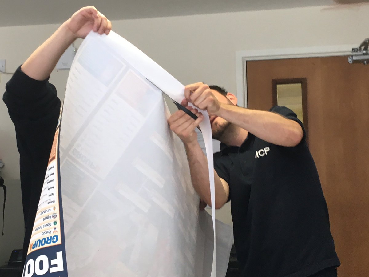 MCPEnviroLLP's tweet photo. We are really excited about the start of #WorldCupRussia2018. Steve and James get to grips with our World Cup Wallchart ready for our sweepstake. https://t.co/aHXfq8UZva  #Russia2018 #WorldCup https://t.co/tUDwdzIQqg