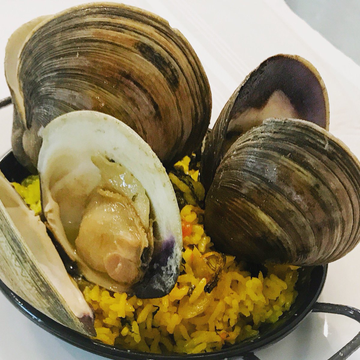 Summer in Cuba tastes like the sea. Experience that feeling with our “Arroz con almejas”, saffron rice with NC clams. #Durham #seatotable