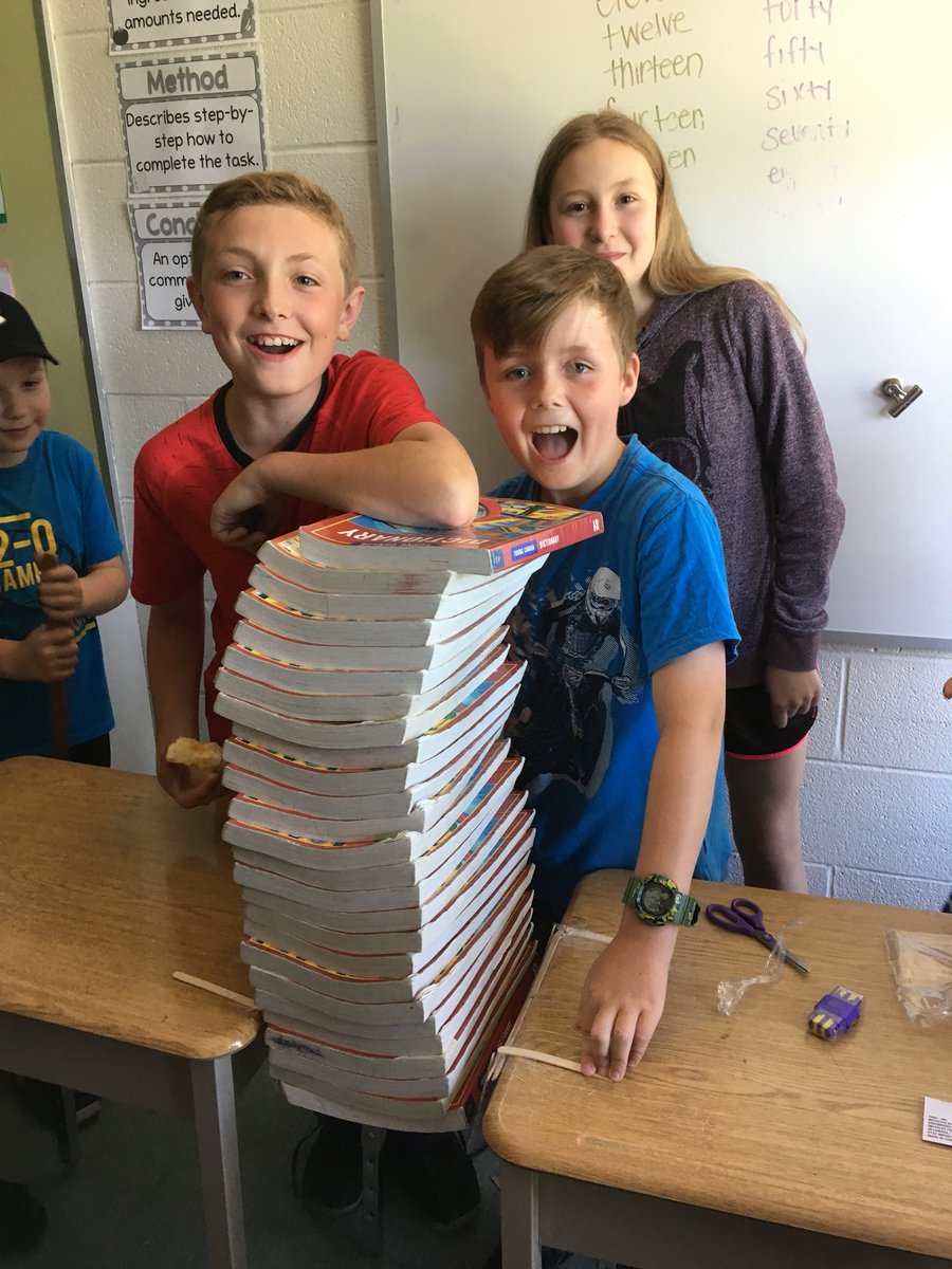 MsLongeway's tweet photo. Science Olympic challenge 2! Using only the materials provided - build a bridge to fill a 37cm gap. How many textbooks can your bridge hold? I think the faces say it all! Floored their bridge could hold 26 textbooks w/o buckling! ππ» #onlyatladymac #TLDSBlearns https://t.co/MQnf73Bpvo