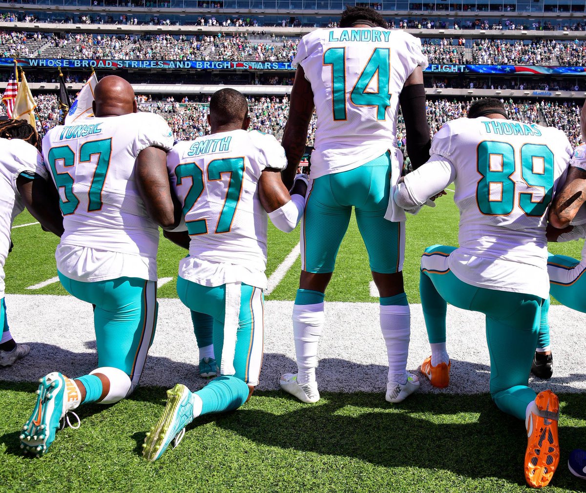 SpinDr's tweet photo. How many American soldiers died during the Korean War so that Donald Trump could salute a North Korean general? 

Yet in Donald Trump’s twisted mind, NFL players disrespect our military by kneeling during the national anthem. https://t.co/8aUrGPBki8