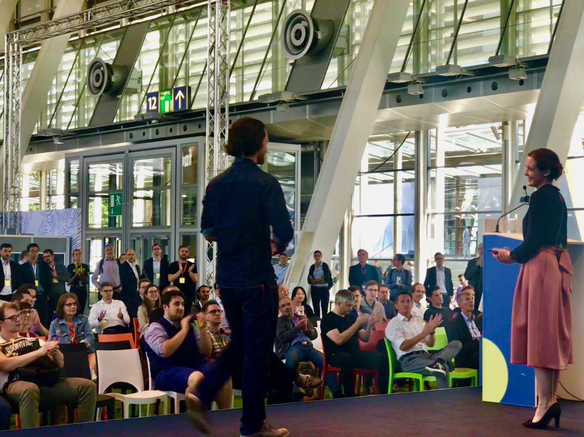 People applauding Clare Jones on stage at CEBIT 2018