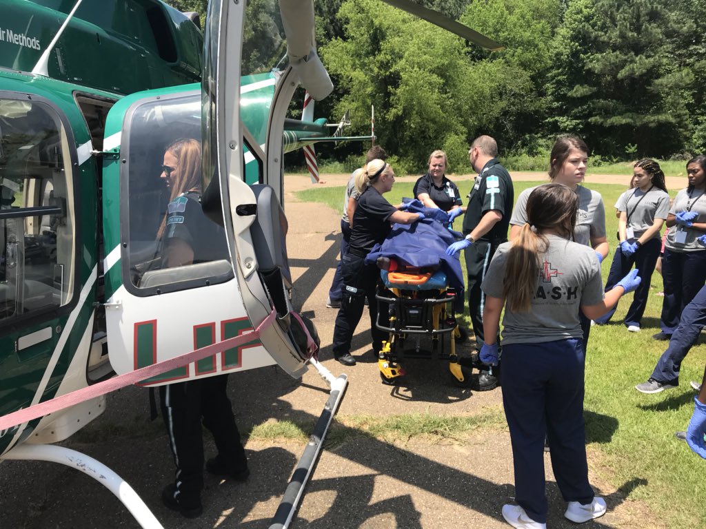 ArFB's tweet image. A simulated, but very authentic trauma  experience highlighted the day for Texarkana M*A*S*H camp students today. They took part in the real-life scenario as a young man with serious injuries was med-flighted to a local hospital and treated. #LifeNet #exploringcareersinmedicine