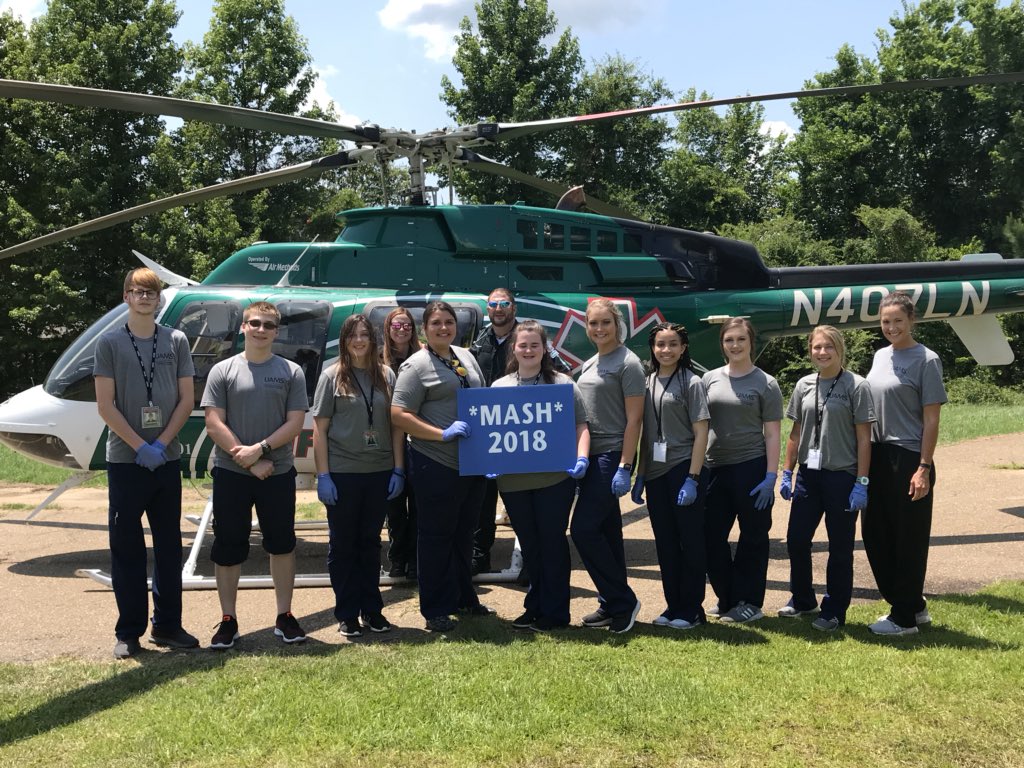 ArFB's tweet image. A simulated, but very authentic trauma  experience highlighted the day for Texarkana M*A*S*H camp students today. They took part in the real-life scenario as a young man with serious injuries was med-flighted to a local hospital and treated. #LifeNet #exploringcareersinmedicine