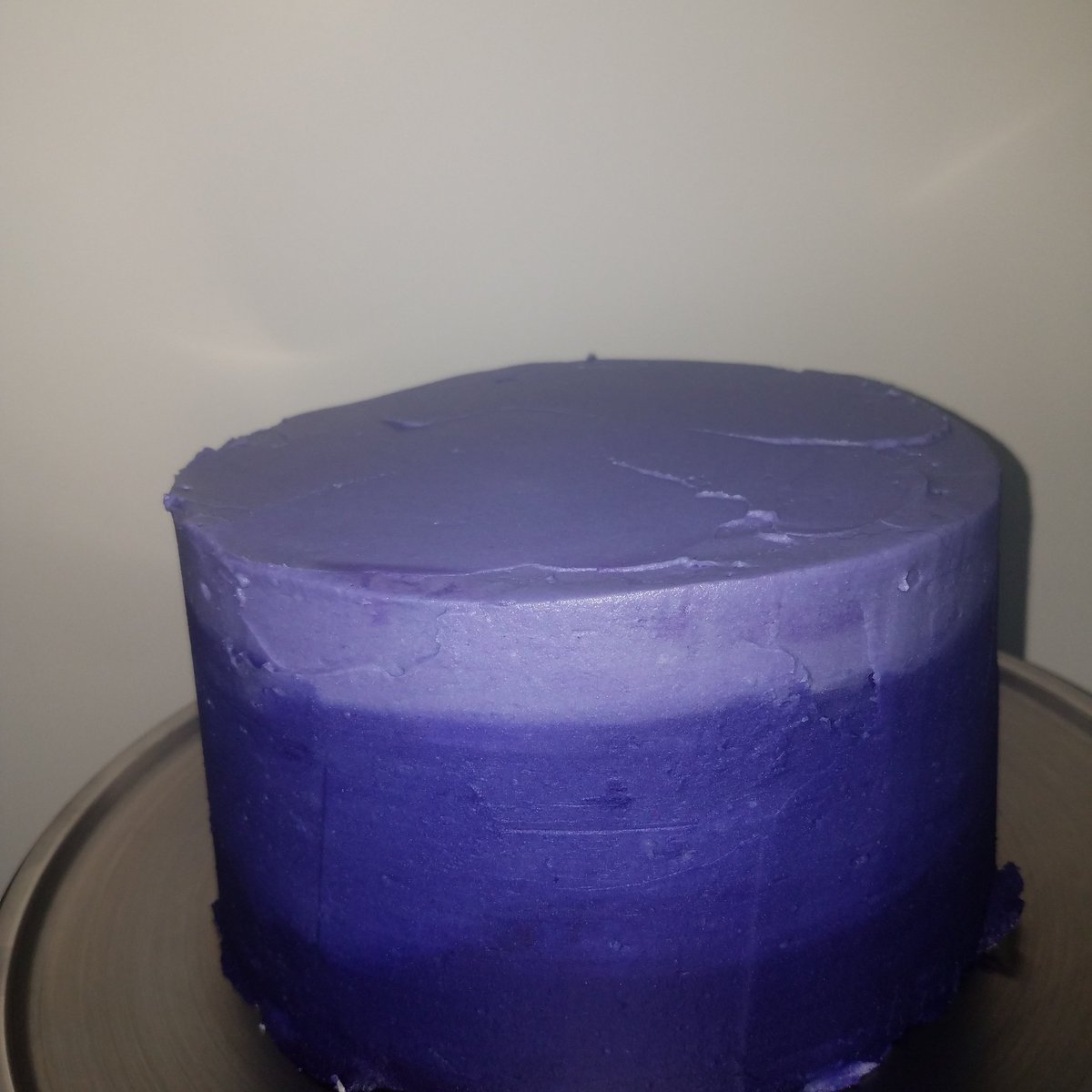 JenCon523's tweet photo. I was working on this when I found out Anthony Bourdain died. I couldn't seem to finish it. This cake reminds me of life sometimes. It's rough, unfinished and didn't turn out the way I had planned. #sweetsbystella #purpleombrecake #ripanthonybourdain #mentalhealthawareness https://t.co/4UzT1s4cMp