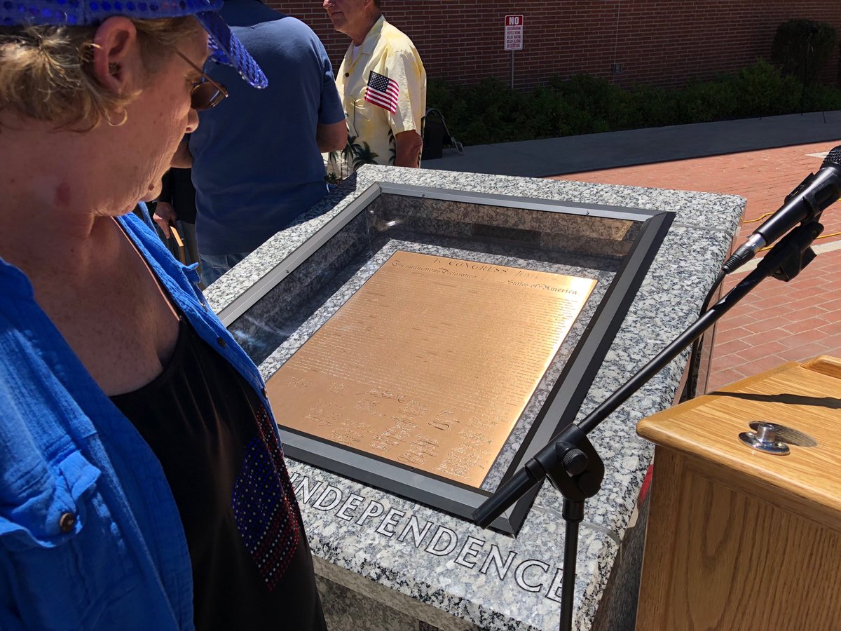 nevadapress's tweet photo. Jenny checks out bronze Declaration of Independence, part of #chartersoffreedom dedicated today at Carson City courthouse on Flag Day. https://t.co/dsAwgyXWe2
