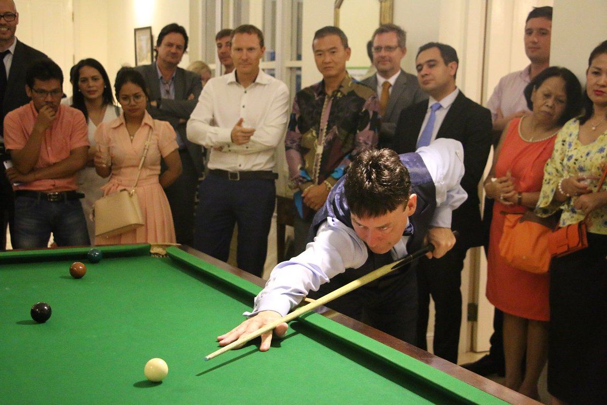 ukincambodia's tweet photo. Ambassador @wjlonghurst  hosted an evening reception with @jimmywhite147 support of local charity @CamKids . The two had a friendly match as guests watch on.  # UKKH #Cambodia https://t.co/LQqj9KsaxR