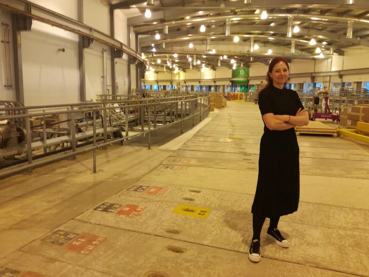 Alice Roberts standing on top of the Diamond storage ring (concrete roof).