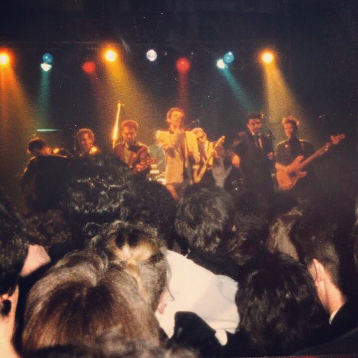 Everyone all crammed in together😅Thanks to Joanna McGahon for posting this great shot today on the ‘Classic Dublin Gigs’ page - The Pogues, Trinity Ball, Dublin 1986 #thepogues #trinityball #dublin #pbass