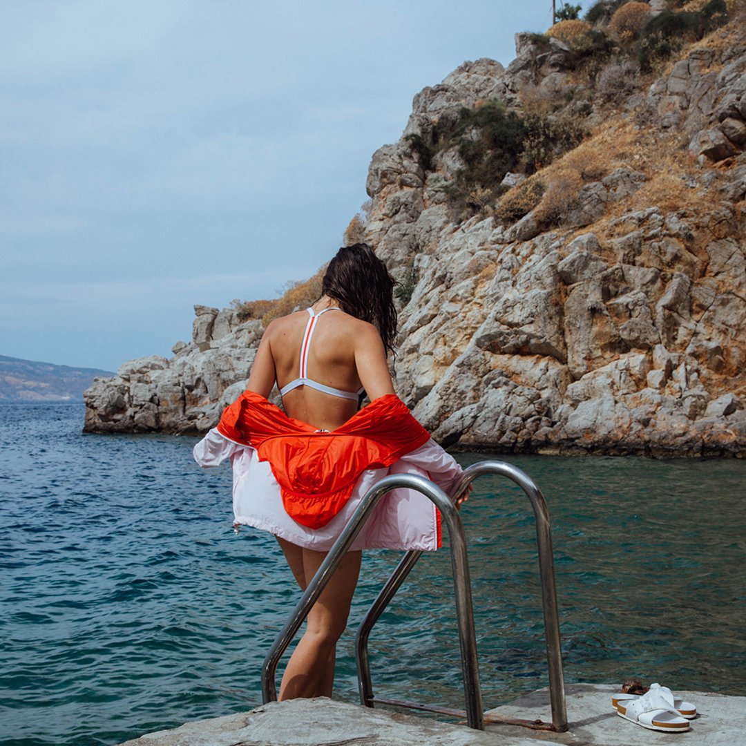 torysport's tweet photo. #vacationvibes: our swimwear, sandals and color-block packable jacket on @Lindsey_calla in Hydra, Greece https://t.co/dCTzJV3Weu