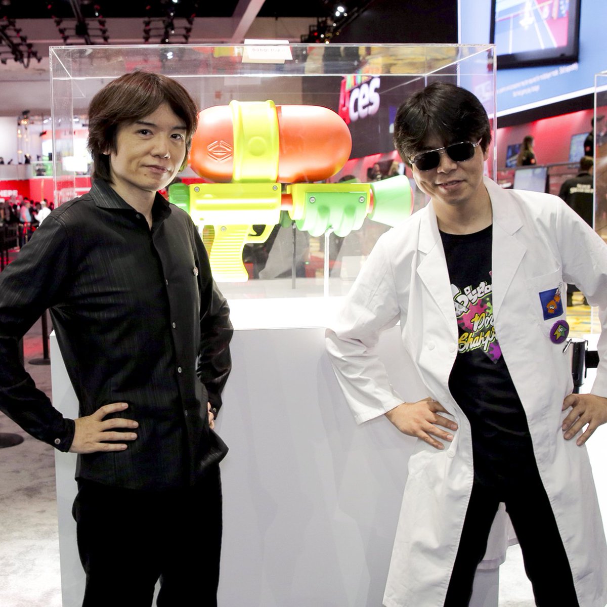 NintendoAmerica's tweet image. Smash Bros. creator Mr. Sakurai poses with a few items from the new Super #SmashBrosUltimate in the #Nintendo #E32018 booth!