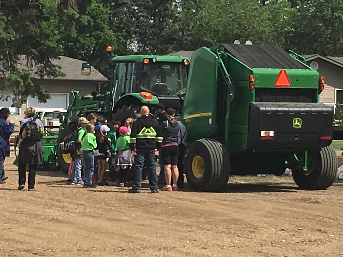PattisonAg's tweet photo. We were thrilled to be a part of Lindgren’s Food Farm Day where we stress farm safety to the students.   We brought down a tractor and baler combo as well as a mower.  So many accidents could be avoided if we just take proper safety precautions.  #StayFarmSafe #AgSafety https://t.co/yK7qkof7Tn