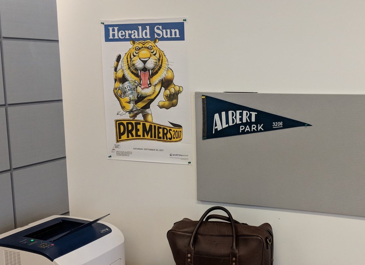 ItsNickReed's tweet photo. I imagine this will eventually contain lots of Knicks and NYGiants stuff - but had to kick off my new #NYC office wall with a @Richmond_FC premiers poster and AP flag! https://t.co/SXyDe2PF3h