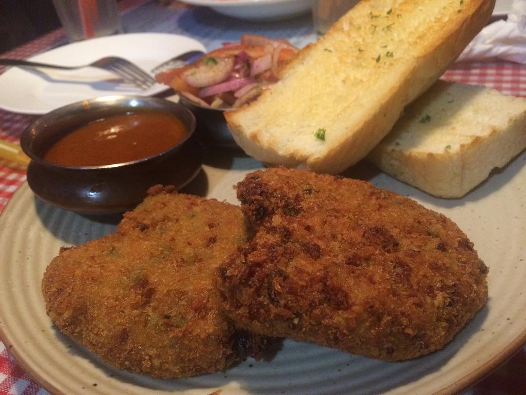 In Picture “Veg Cutlet Pao” @dinshawsxcafe Andheri West . . #bawanubhonu as they call it. It’s a Parsi dish. . . #vegcutletpao #cutlet #pao #dinshawsxpresscafe #forcedfoodie #foodiechhokra #andheriwest #vegeteriandish #parsidish #parsifood #parsicuisine #dinshaws #oshiwara