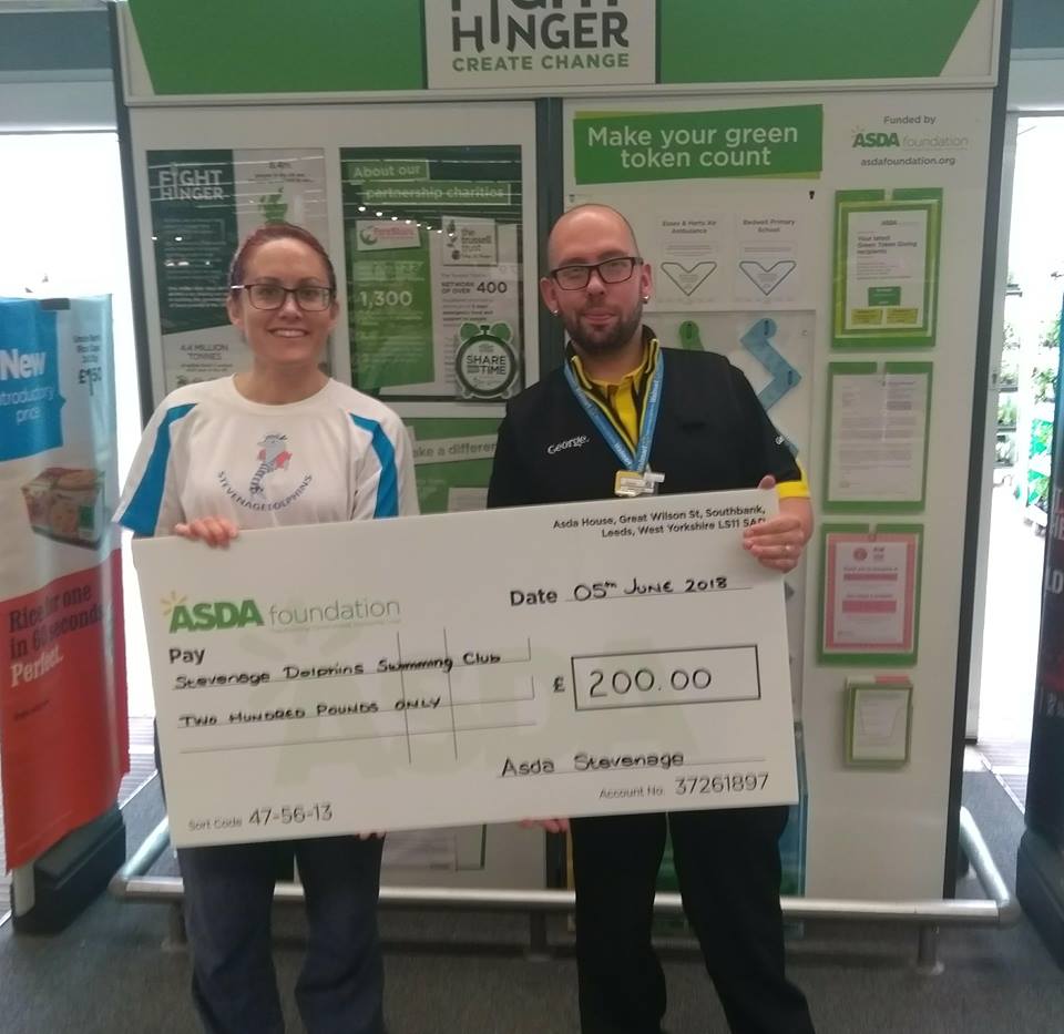 Here is Claire receiving a cheque for £200 from Jamie at <a href="/asda/">Asda</a> #Stevenage from the green token scheme. 
Many thanks to all who voted for Dolphins.
