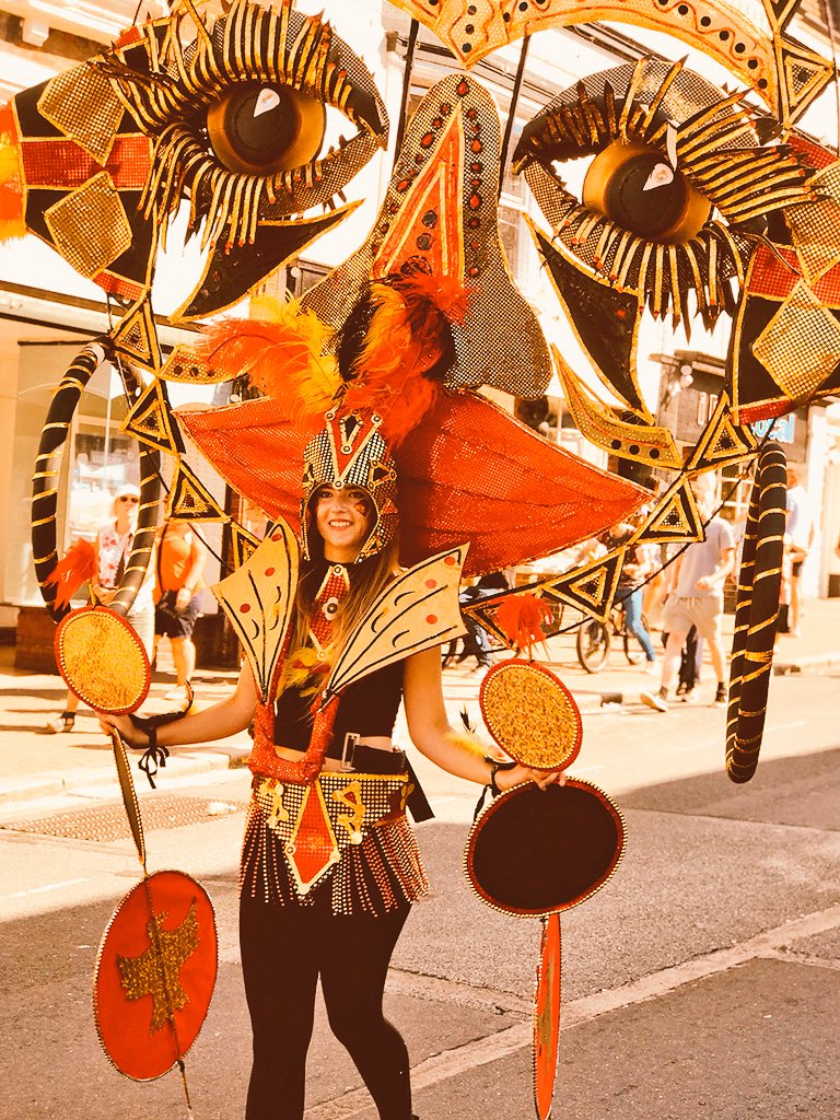HENLEYDARREN's tweet photo. A riot of colour, music and dance in the sunshine in Ryde on the Isle of Wight today for #IWMardisGras from #ACEsupported @NewCarnivalCo - around a thousand young people taking part in the carnival parade. https://t.co/uIYcWYY4nm
