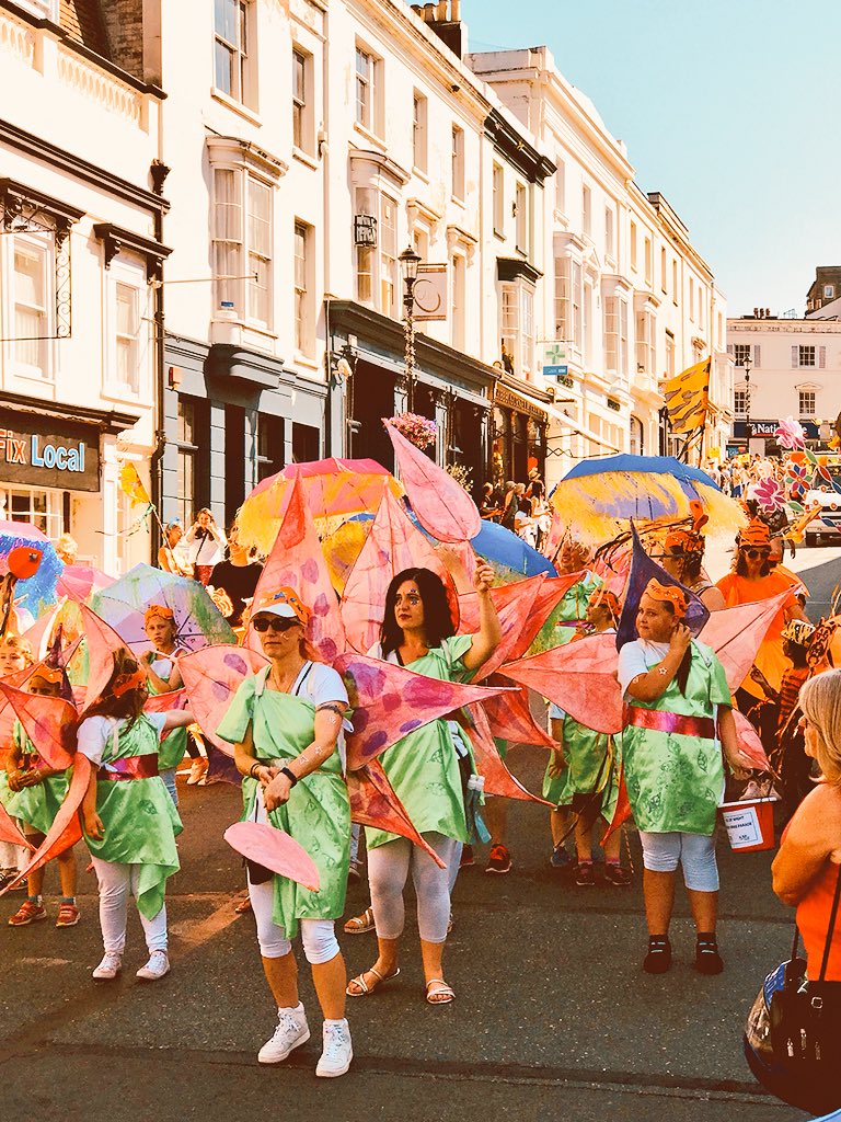 HENLEYDARREN's tweet photo. A riot of colour, music and dance in the sunshine in Ryde on the Isle of Wight today for #IWMardisGras from #ACEsupported @NewCarnivalCo - around a thousand young people taking part in the carnival parade. https://t.co/uIYcWYY4nm