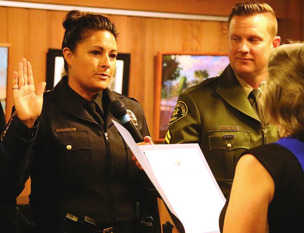 Capitola Police Sgt. Sarah Ryan is sworn in as the first female sergeant for the department Thursday.