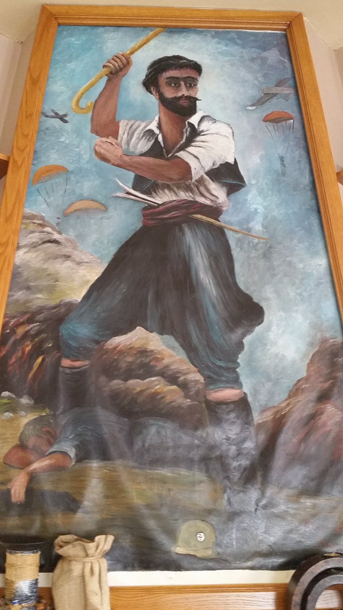 CreteVisitor's tweet image. Painting over the fireplace - painted by the owner of the taverna.