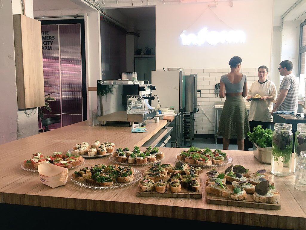 MakeCityBerlin's tweet photo. MakeCity visitors had a tasty tour of the @INFARMBerlin HQ in Berlin Kreuzberg this morning. Did you know 1 #verticalfarm produces 1000 plants? 🌱 Special thanks to Ina Lachmund and the culinary team who made sure we didn’t leave hungry! #FarmToFork #UrbanFarm #MakeCity2018 https://t.co/Ja8lwPu35V