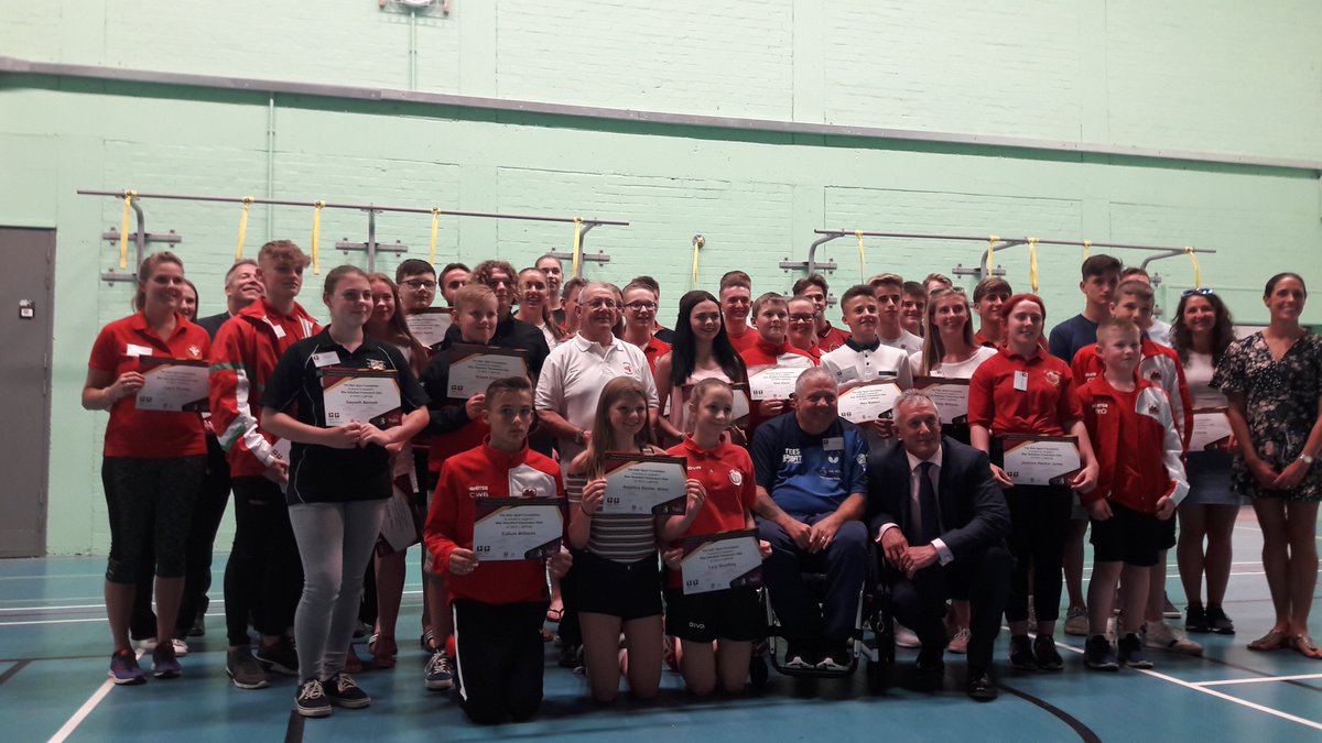 Halo_SF's tweet photo. Some of the 147 local sports people being supported by the Halo Sport Foundation receiving their awards at last night's ceremony in Bridgend County. The group are joined by the Foundation Patron, rugby legend Rob Howley. #SportMakesCommunities https://t.co/NXfH8uhjEv