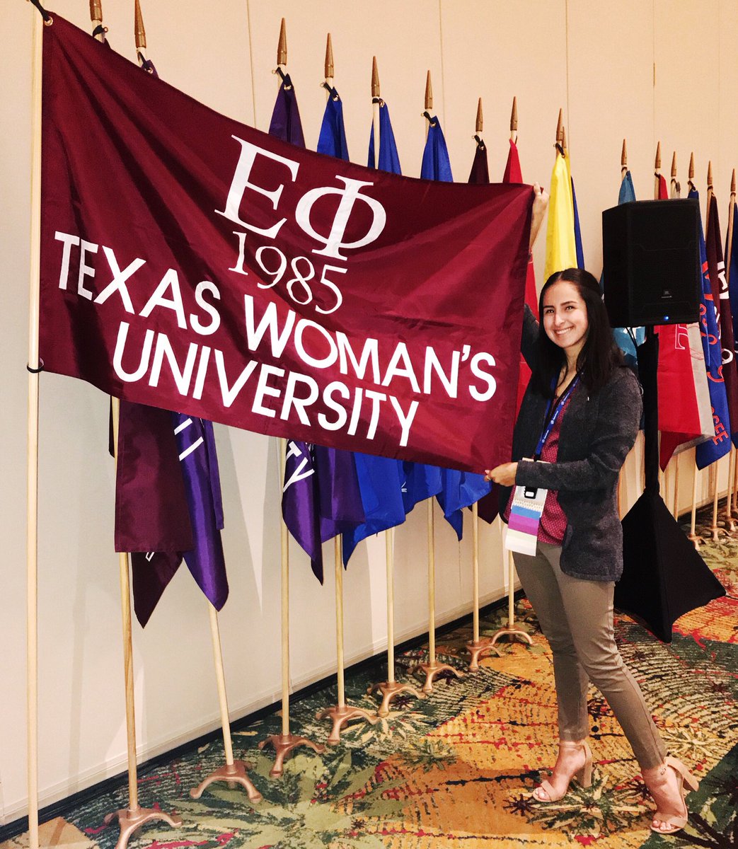 Look how cute our prez looks in front of our official flag at the #alphagamconvention !!