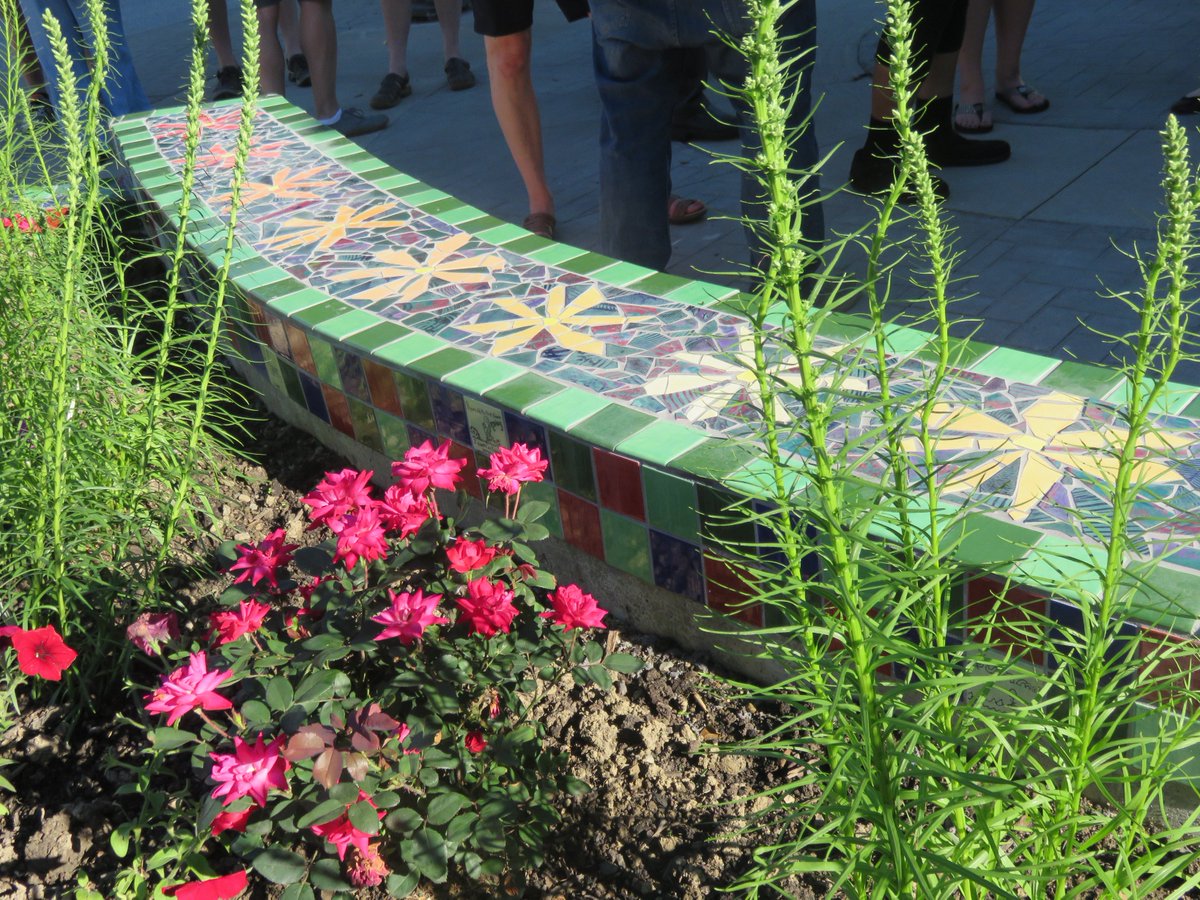 CLEPublicArt's tweet photo. When you not only #ENGAGE, but also invite a community to PARTICIPATE in creating #PublicArt, beautiful things happen...Each tile painted by the people, mosaic by artist Angelica Pozo. Come enjoy the garden. #HaveASeat #TalkToYourNeighbors #ColorandVibrancy #TremontGeneralStore https://t.co/KUcQJx8sZU