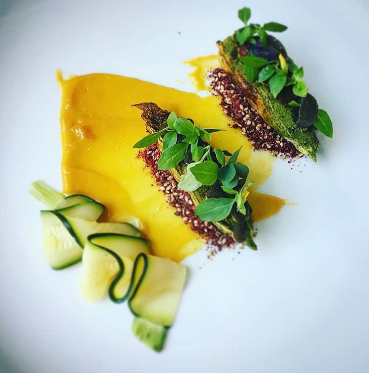 Brasstown Beef short rib. Squash blossom. Smoked serviceberry harissa. Zaatar ish. Feta brine caramel and squash puree. Dish by Chris.