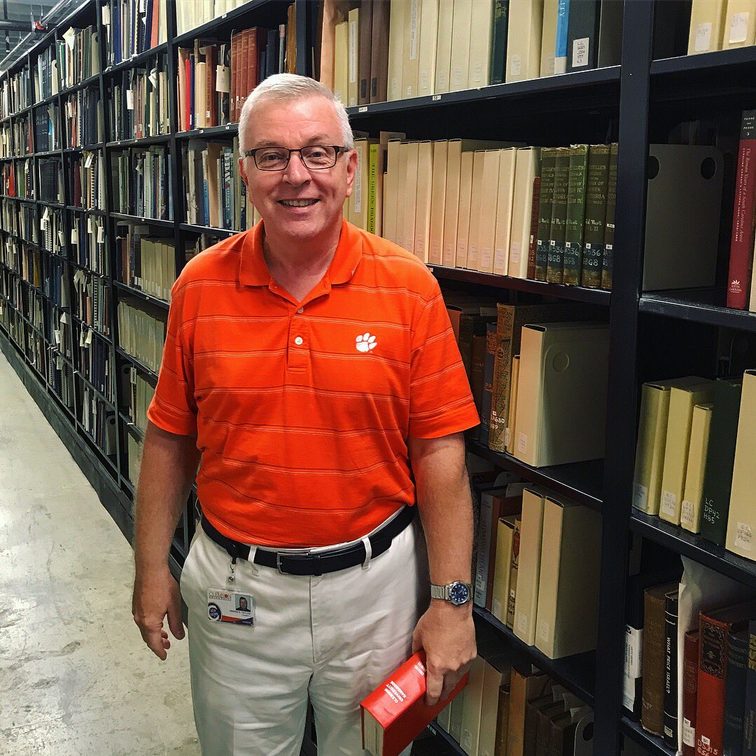 OurClemson's tweet image. Meet Dennis Taylor, university archivist! Dennis works to collect, preserve, and provide access to the @clemsonuniversity historical records and documents. 📜 He has been at Clemson for 31 years, 😳 but has only 20 days before he enters retirement! #FacesOfClemson