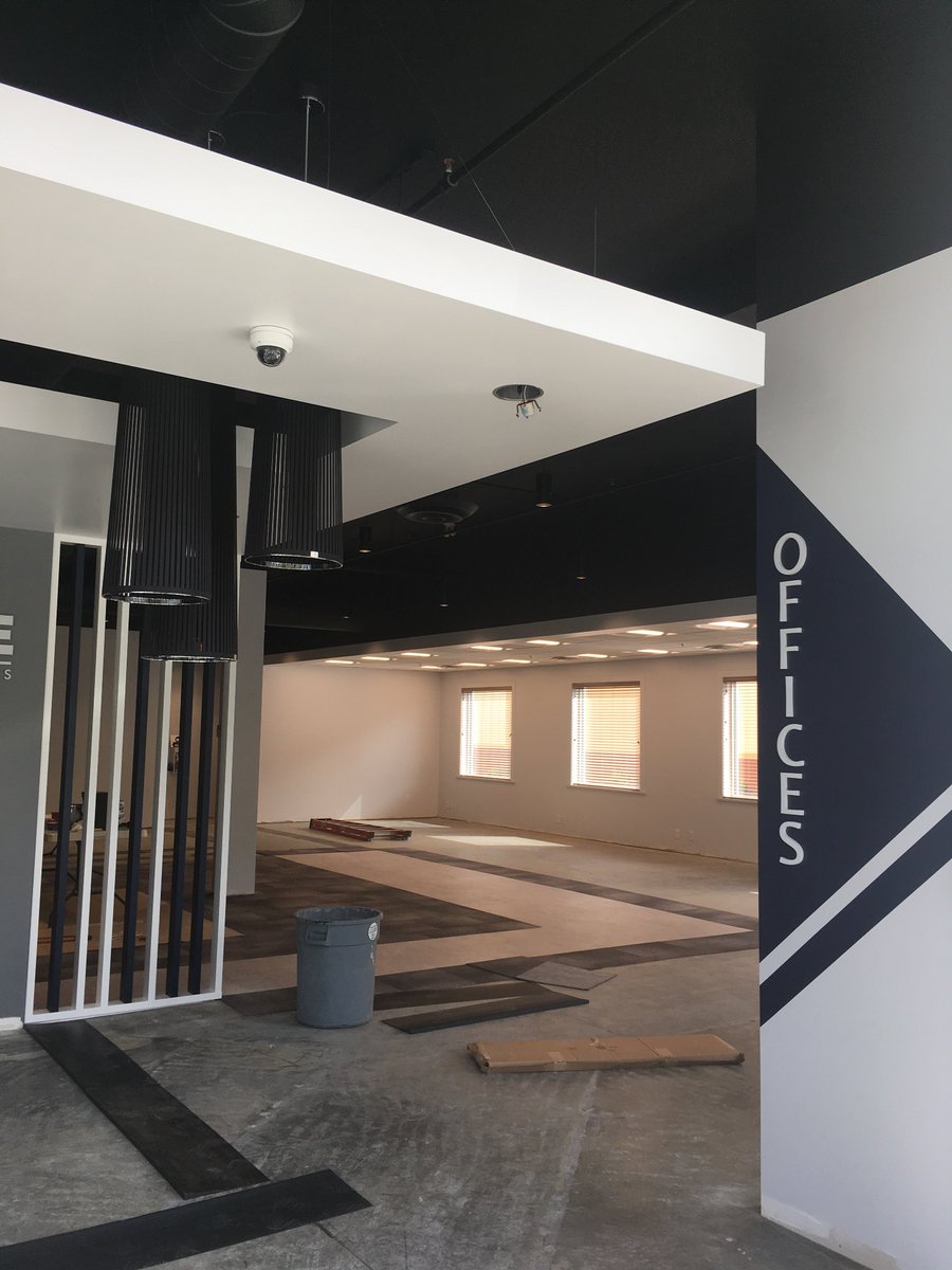 THIS WAY | Clear signage is the key to successful navigation, and in a showroom, navigation is everything. #BecauseGoodDesignIsGoodBusiness #commercialinteriordesign #interiordesign #navigation #signage #success #navy #showroom #office #kelowna #okanagan #ylw