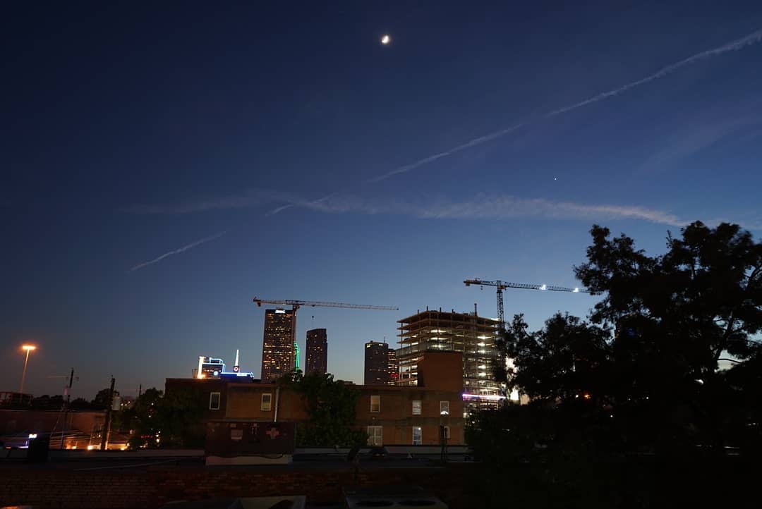 You can see #DeepEllum &amp; #DowntownDallas from our rooftop patio! Take a look out over #ElmStreet to see all the action going on from up on the #patio. Don't forget #happyhour is $3 #wines, #wells, + #domesticbeers until 8 p.m dallasgreenroom.com #rooftoppatio #mydtd #dfw