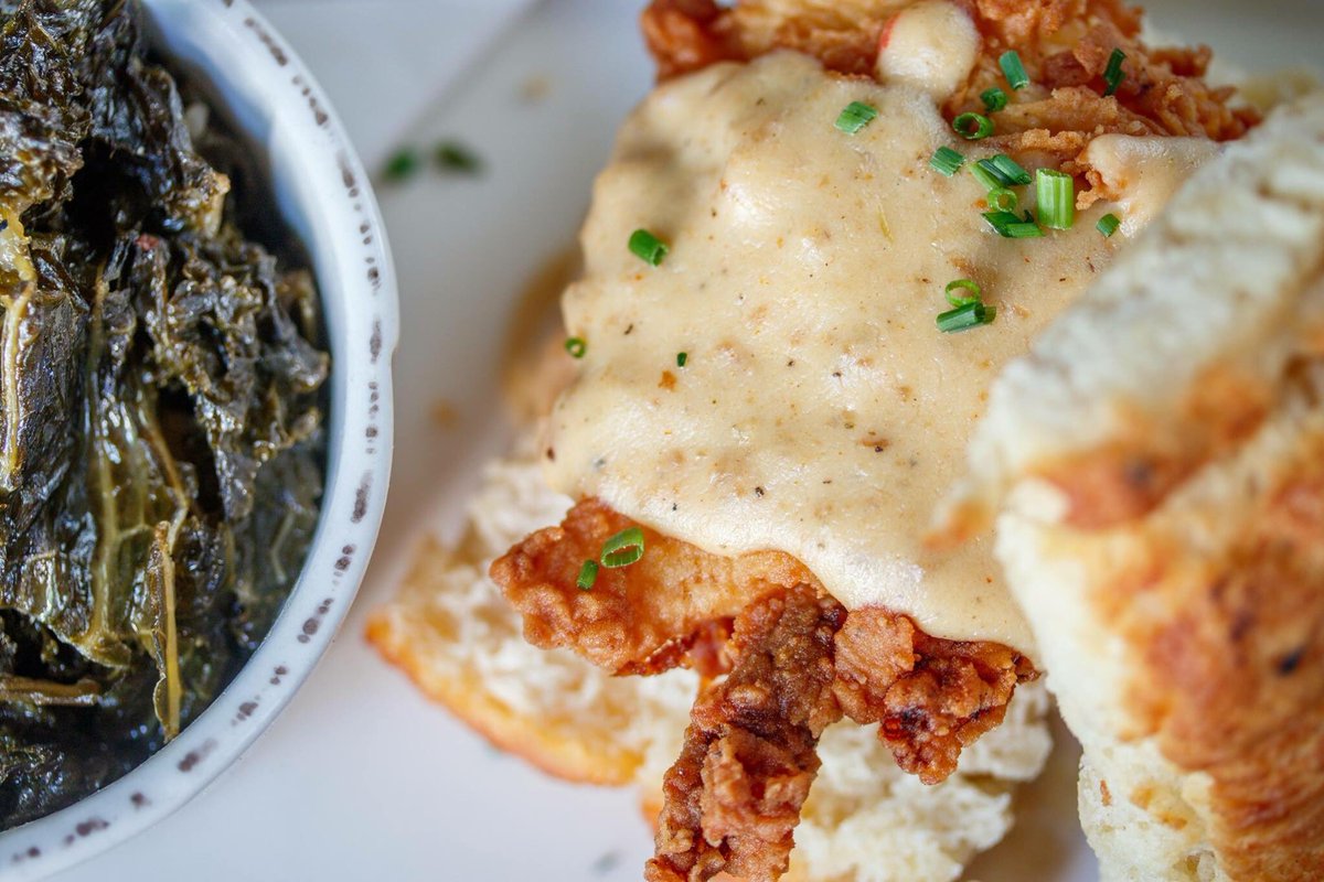 ✨A Southern bruncher's dream✨ // Butterdrop biscuits, fried chicken breast {traditional or Nashville hot🔥} + sausage gravy. We recommend our braised Harvest greens on the side! Brunch is served from 10-3 Saturday + Sunday.