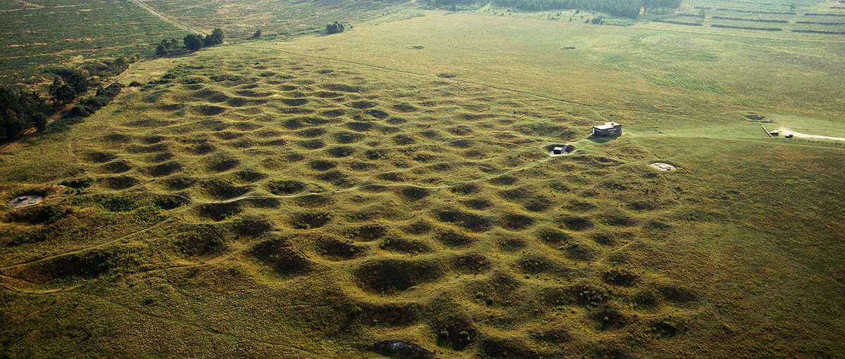 Below this pockmarked landscape lie 400 pits as deep as 47 feet where flint was mined between ca 2600-2300 BCE. Named for an Anglo-Saxon or Danish landholder or god, #GrimesGraves are situated on nearly 20 acres of Breckland heath near #ThetfordForest, Norfolk.