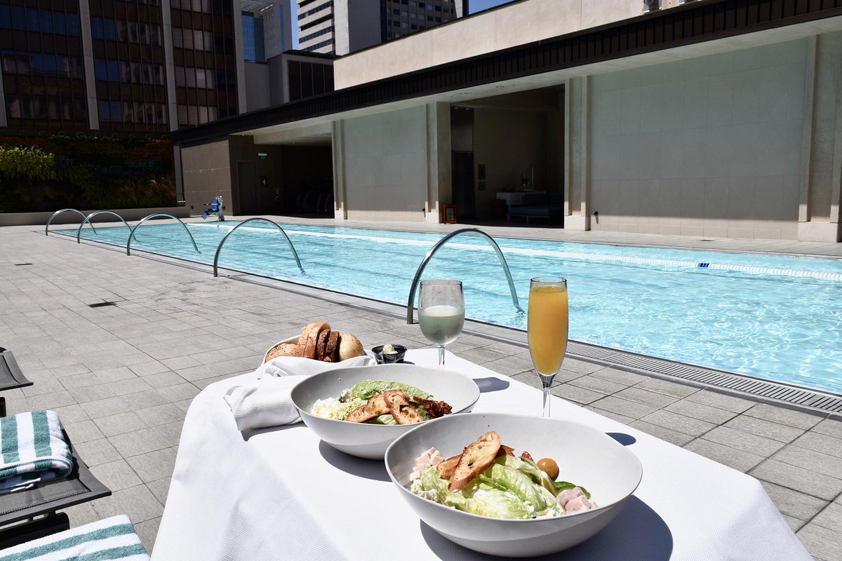 Relax after your workout with lunch on the rooftop pool deck. 📸  @samwormser #rooftoplunch #weekend #sandiego